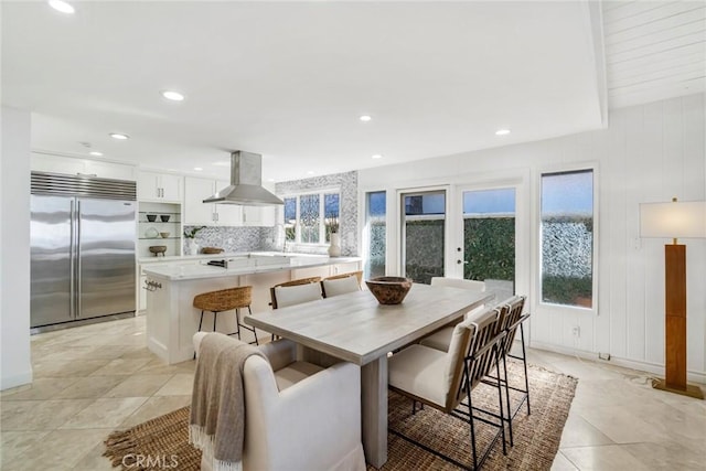 dining area featuring recessed lighting and light tile patterned floors