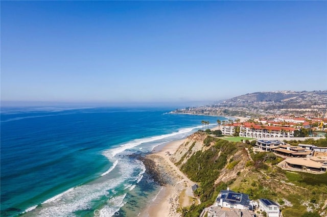 birds eye view of property featuring a water view and a view of the beach