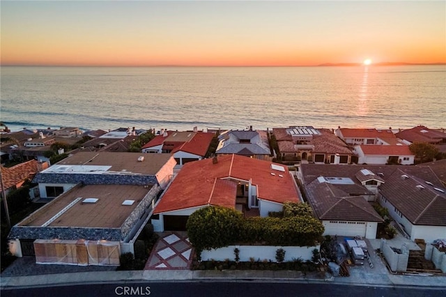 aerial view featuring a water view and a residential view