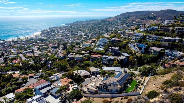 drone / aerial view featuring a residential view and a water view