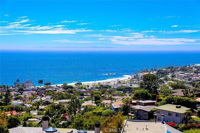 drone / aerial view with a water view, a residential view, and a view of the beach