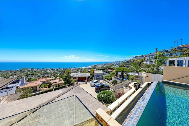 view of pool with a fenced in pool, a water view, and fence