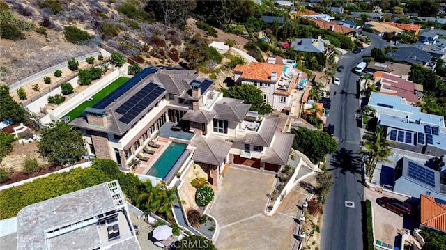 birds eye view of property with a residential view