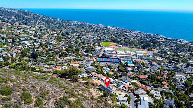 drone / aerial view with a water view and a residential view