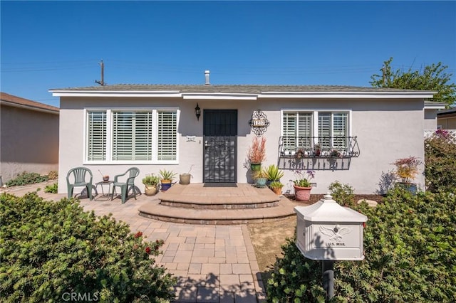 view of front of property featuring stucco siding