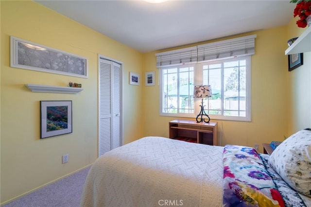 carpeted bedroom with a closet