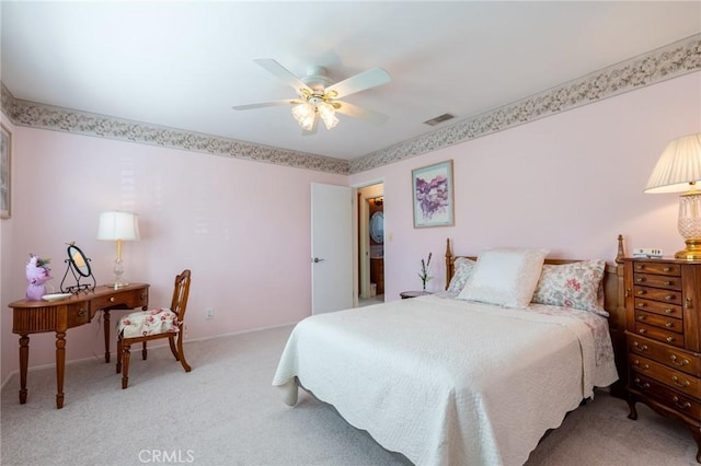 bedroom featuring baseboards, carpet, visible vents, and ceiling fan