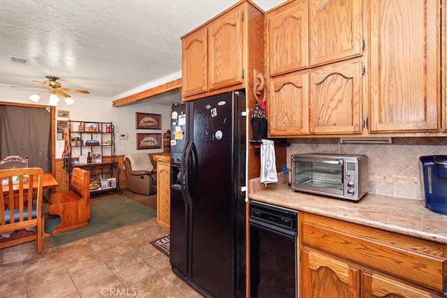 kitchen featuring tasteful backsplash, visible vents, black fridge with ice dispenser, ceiling fan, and light countertops