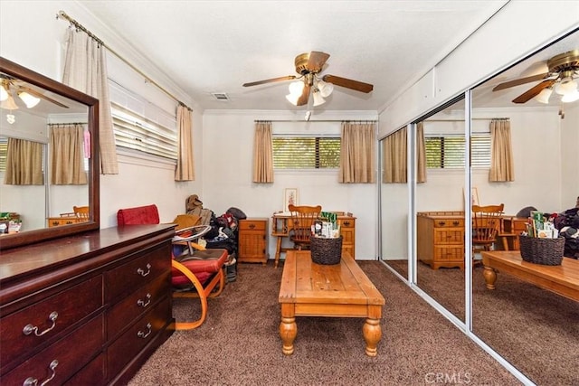 sunroom featuring visible vents and ceiling fan