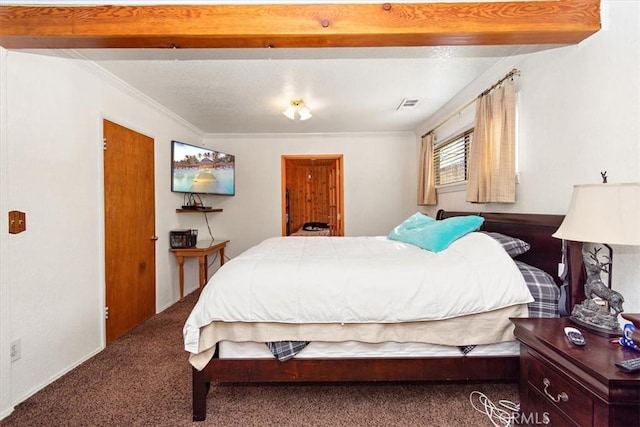 bedroom with ornamental molding, carpet, and visible vents