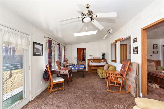 living area featuring ceiling fan, crown molding, vaulted ceiling, and carpet flooring