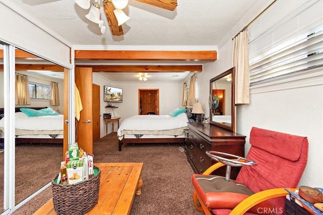 bedroom with crown molding, dark carpet, and a textured ceiling