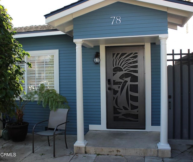 doorway to property with fence