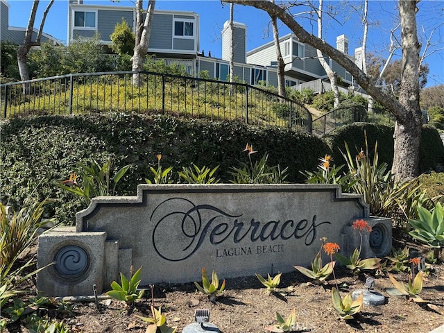 community sign with fence