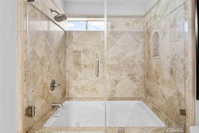 bathroom featuring shower / bath combination with glass door