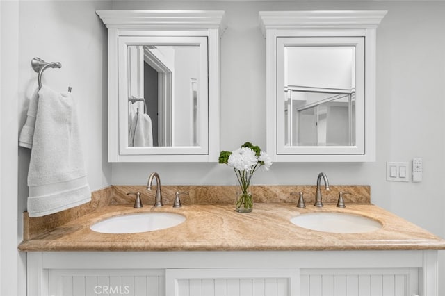 full bathroom featuring a sink and double vanity