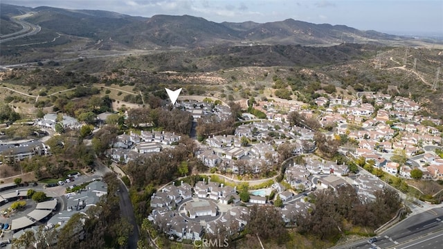 birds eye view of property with a mountain view and a residential view