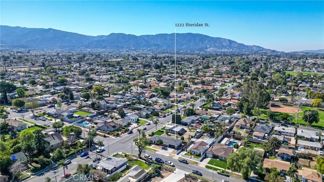 birds eye view of property with a residential view and a mountain view