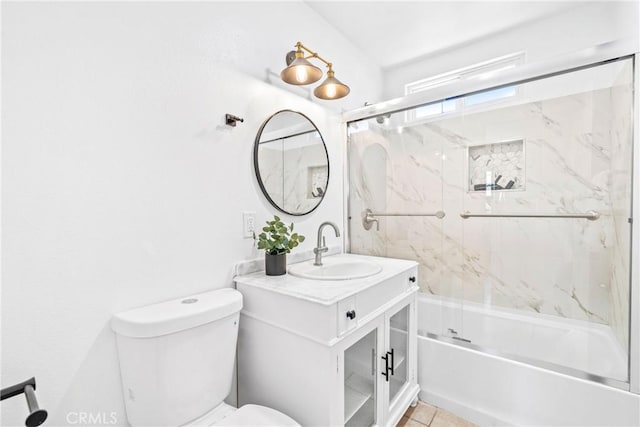 full bath featuring shower / bath combination with glass door, vanity, toilet, and tile patterned floors