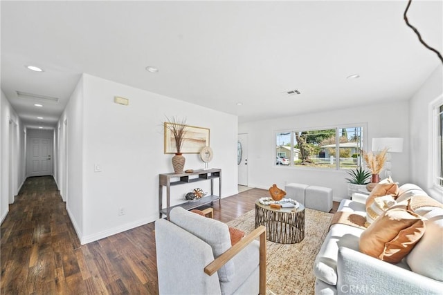 living area with recessed lighting, wood finished floors, and baseboards