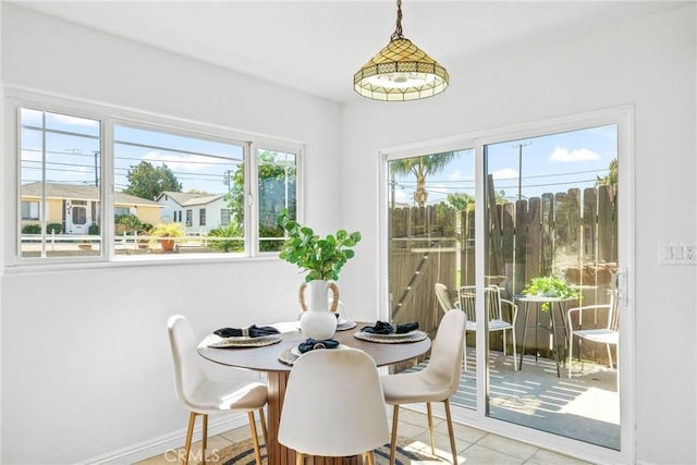 tiled dining space with baseboards