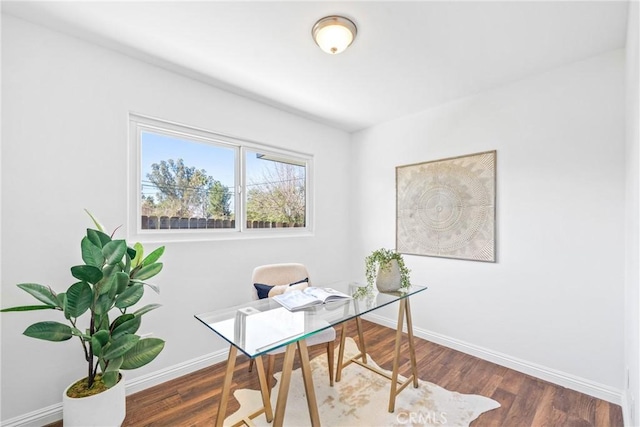 office featuring baseboards and wood finished floors