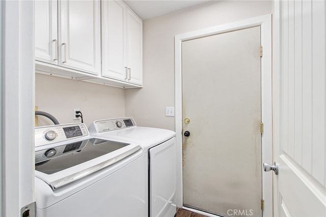 laundry area with cabinet space and independent washer and dryer