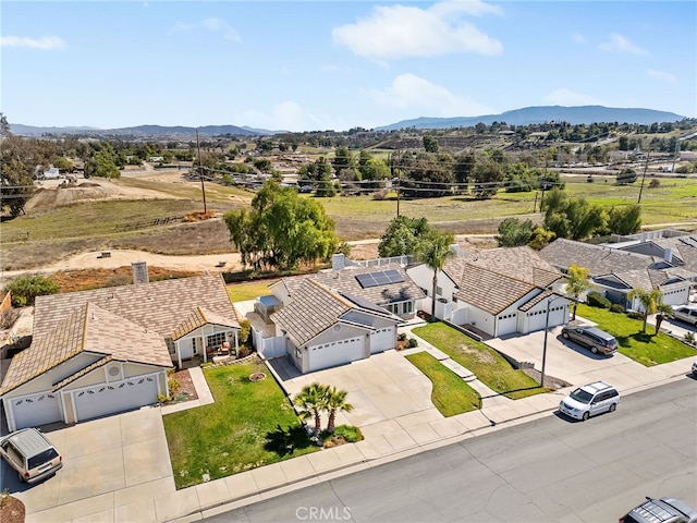 drone / aerial view with a residential view and a mountain view