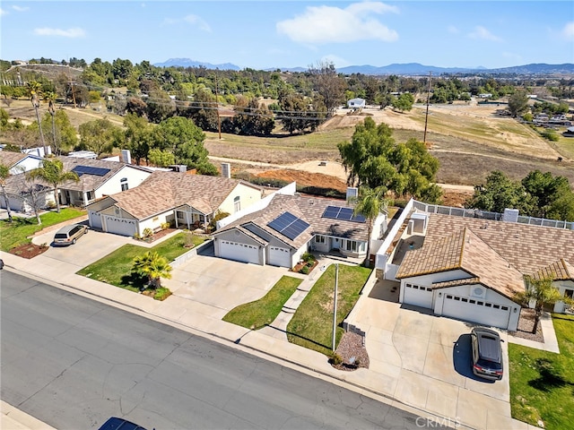 aerial view with a mountain view and a residential view