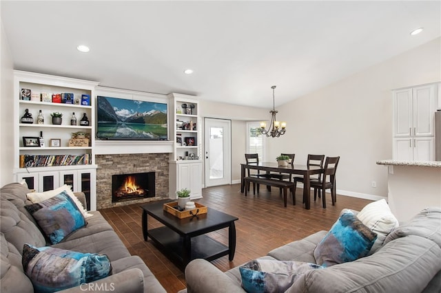 living area featuring dark wood-style floors, a fireplace, baseboards, and recessed lighting