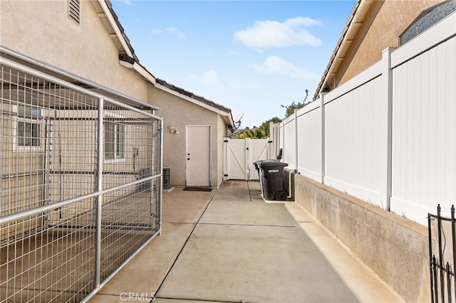 view of patio / terrace featuring a gate and fence