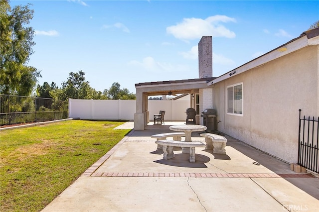 view of patio with a fenced backyard and area for grilling