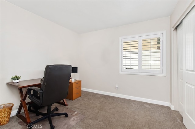 carpeted office with baseboards