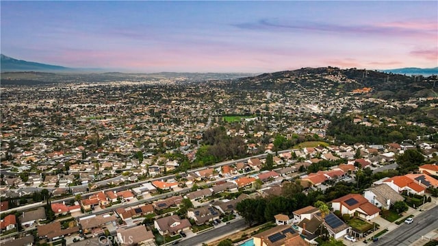 drone / aerial view with a residential view and a mountain view