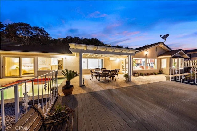 wooden deck with outdoor dining area