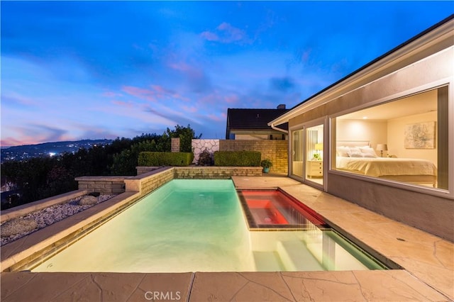 view of swimming pool with a fenced in pool, a patio area, and fence