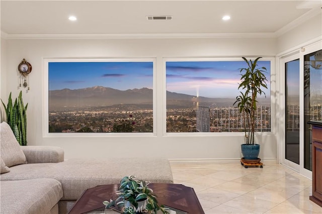 living area with visible vents, a mountain view, crown molding, and recessed lighting