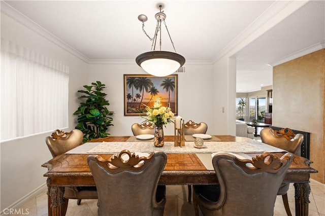 dining room with ornamental molding, light tile patterned flooring, visible vents, and baseboards