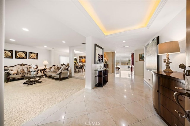 living area featuring light carpet, light tile patterned floors, a raised ceiling, and recessed lighting