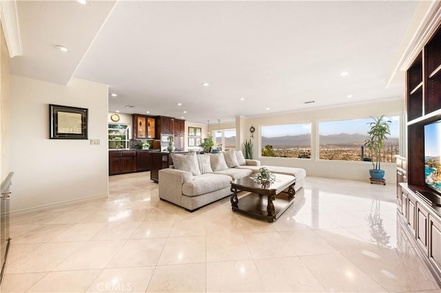 living room with light tile patterned floors, baseboards, a wealth of natural light, and recessed lighting