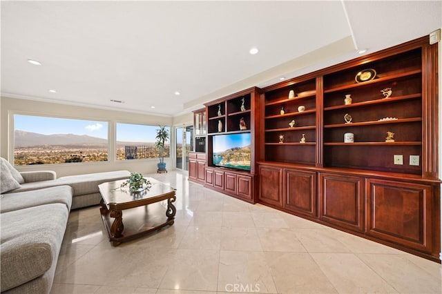 living room featuring crown molding and recessed lighting