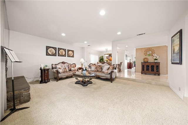 living room with recessed lighting, visible vents, and baseboards