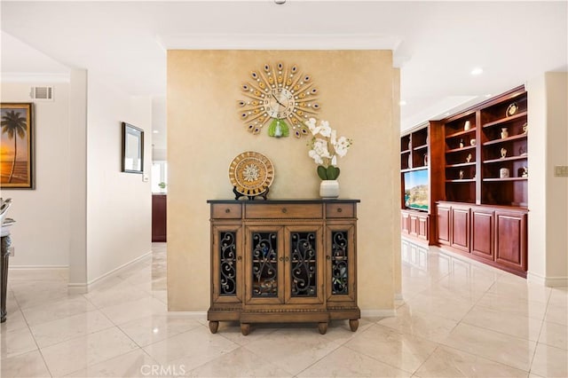 hall featuring baseboards, visible vents, marble finish floor, crown molding, and recessed lighting