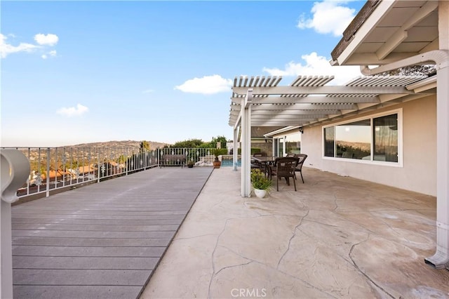 view of patio featuring outdoor dining space and a pergola