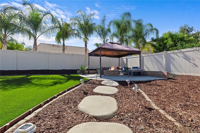 view of yard featuring a fenced backyard, a patio, and a gazebo