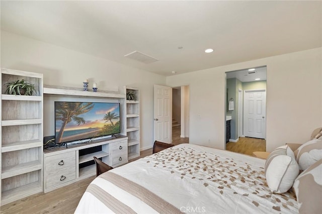 bedroom featuring light wood-style flooring and recessed lighting