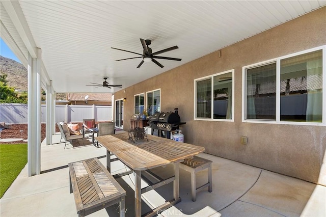 view of patio / terrace featuring a ceiling fan, an outdoor hangout area, a grill, fence, and outdoor dining area