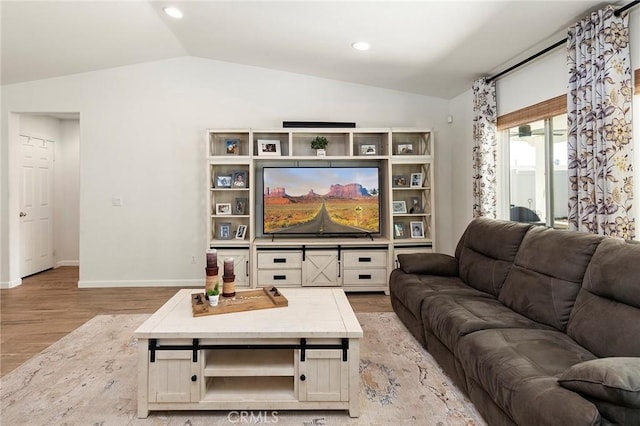 living room with lofted ceiling, light wood-style floors, baseboards, and recessed lighting