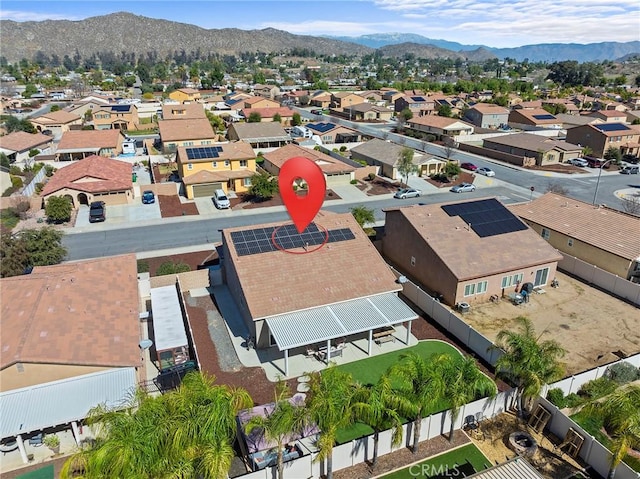 drone / aerial view featuring a residential view and a mountain view