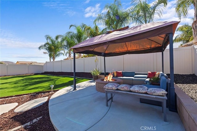 view of patio / terrace featuring a gazebo, an outdoor fire pit, and a fenced backyard